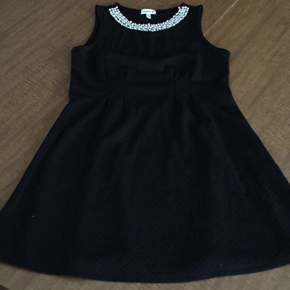 Formal black dress with pearl neckline detail